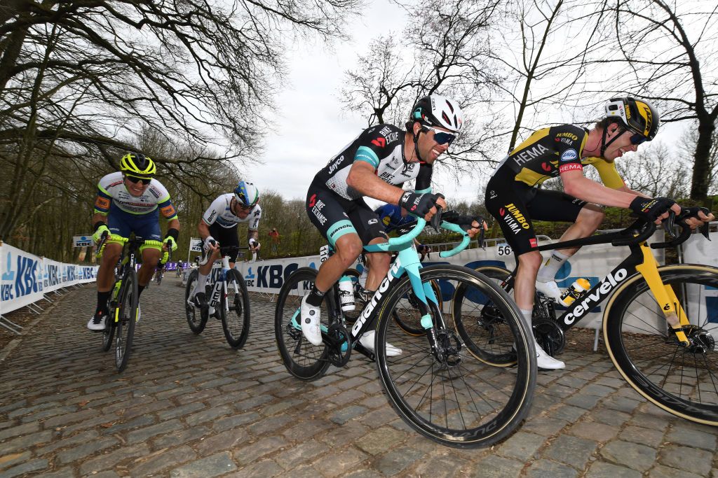 WEVELGEM BELGIUM MARCH 28 Giacomo Nizzolo of Italy and Team Qhubeka Assos Michael Matthews of Australia and Team Team BikeExchange Nathan Van Hooydonck of Belgium and Team Jumbo Visma during the 83rd GentWevelgem in Flanders Fields 2021 Mens Elite a 254km race from Ypres to Wevelgem Kemmelberg Ossuaire Cobblestones GWE21 GWEmen FlandersClassic on March 28 2021 in Wevelgem Belgium Photo by Tim de WaeleGetty Images