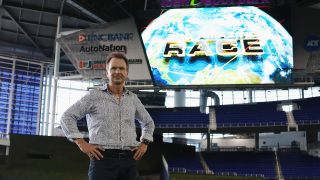 Phil Keoghan standing in the Marlins stadium in Miami during the final leg of The Amazing Race Season 37.