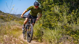 Shimano's new groupset being ridden on a dry singletrack trail