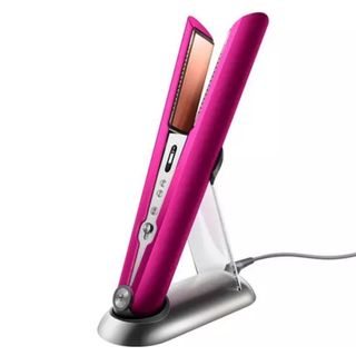 dyson corrale black friday - pink straighteners in a stand