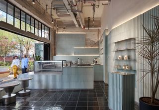 Fotografiska Shanghai by AIM Architecture showing the building's blend of old and new with raw concrete and plush interiors