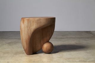 Sinuous hand carved wooden stool