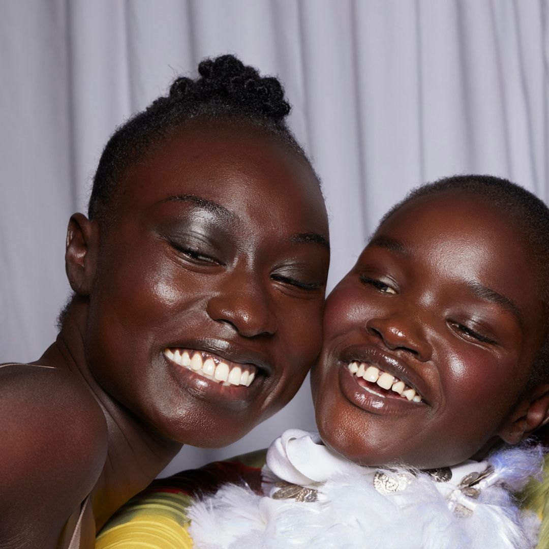A trio of models at the Altuzarra S/S &#039;23 show smiling as they posed for a selfie