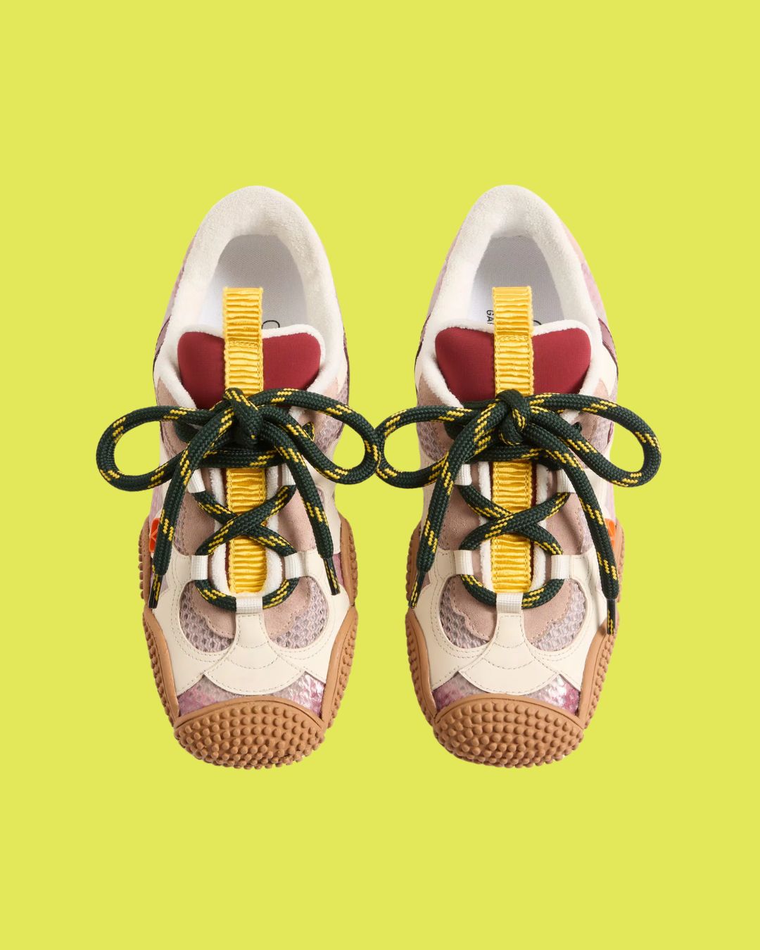 Amphibia Trainer in Rubberised Calfskin and Calfskin against bright yellow background.