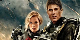 Edge of Tomorrow Emily Blunt and Tom Cruise stand on the battlefield