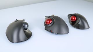 A picture showing three of Eleocm's thumb-operated trackball mice