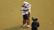 Brooks Koepka embraces caddie Ricky Elliott after winning the 2023 PGA Championship