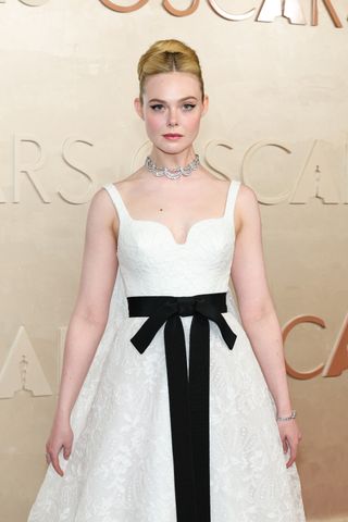 elle fanning wears givenchy at the 2025 oscars with a vintage cartier necklace