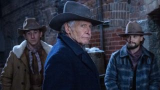 From left to right, a cowboy, Harrison Ford as Jacob in the middl eand Darren mann as Jack Dutton standing behind him. 