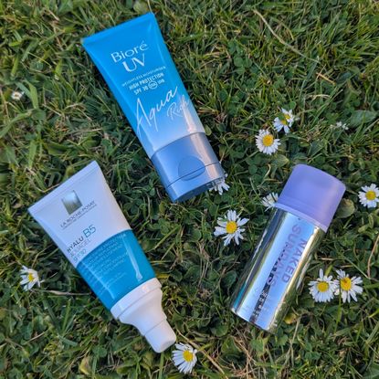 a flatlay image of three of the best water-based sunscreens