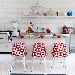 kitchen with bar stools and white tiles