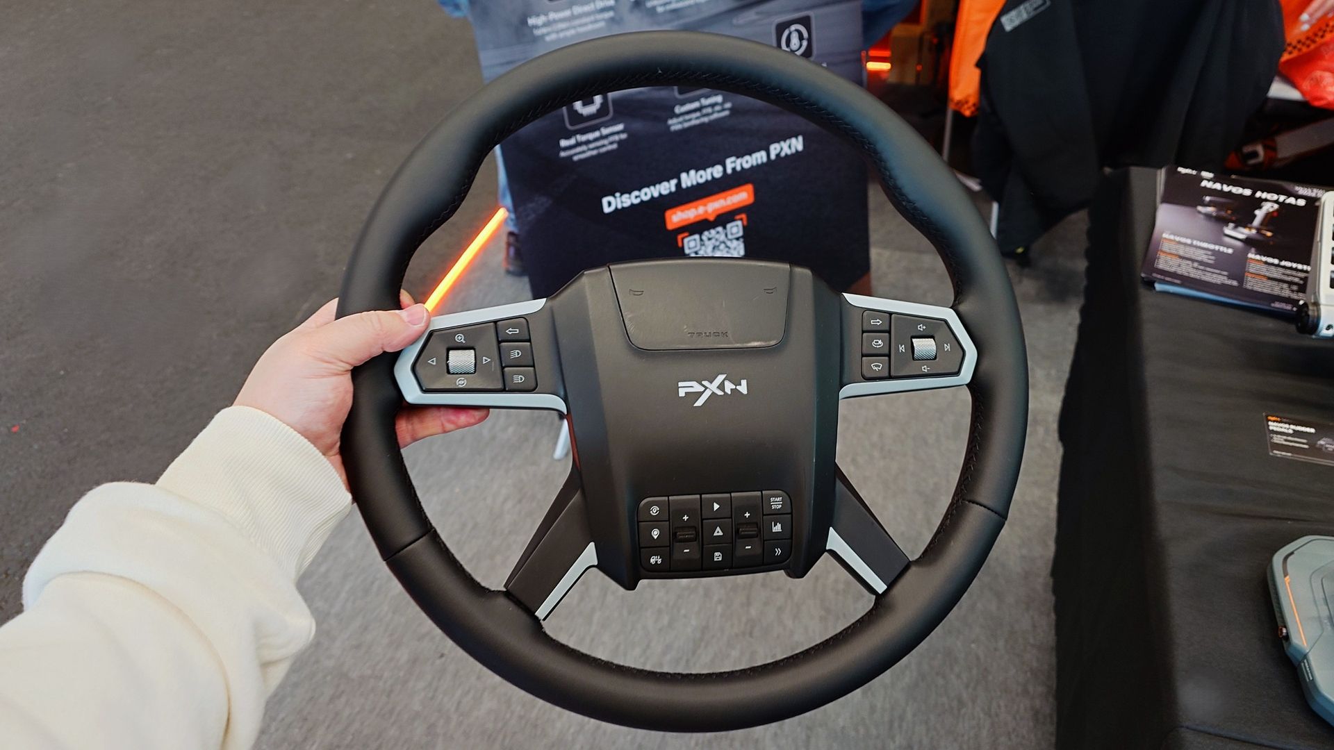 Close up photos of the new and unreleased PXN truck simulator wheel showing the design and controls.