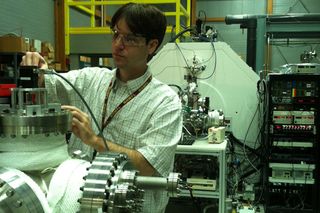 Paul Dunk checks equipment during magnet time at the MagLab’s Ion Cyclotron Resonance lab.