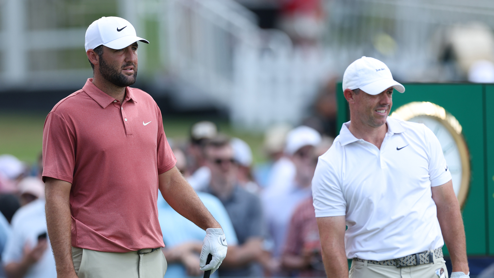 Scottie Scheffler and Rory McIlroy watch a tee shot