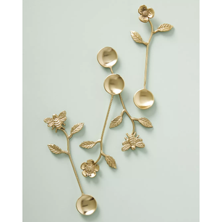 gold teaspoons with a floral design
