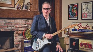 Joe Bonamassa at the Nerdville Museum holding a Fender Stratocaster