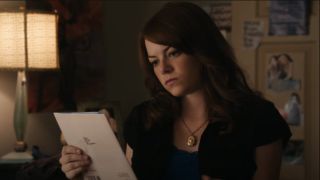 Emma Stone looking at a birthday card in easy A.