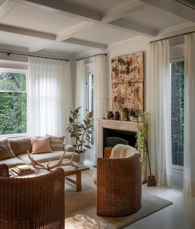 How high to hang a curtain rod to make your room feel bigger Livingetc