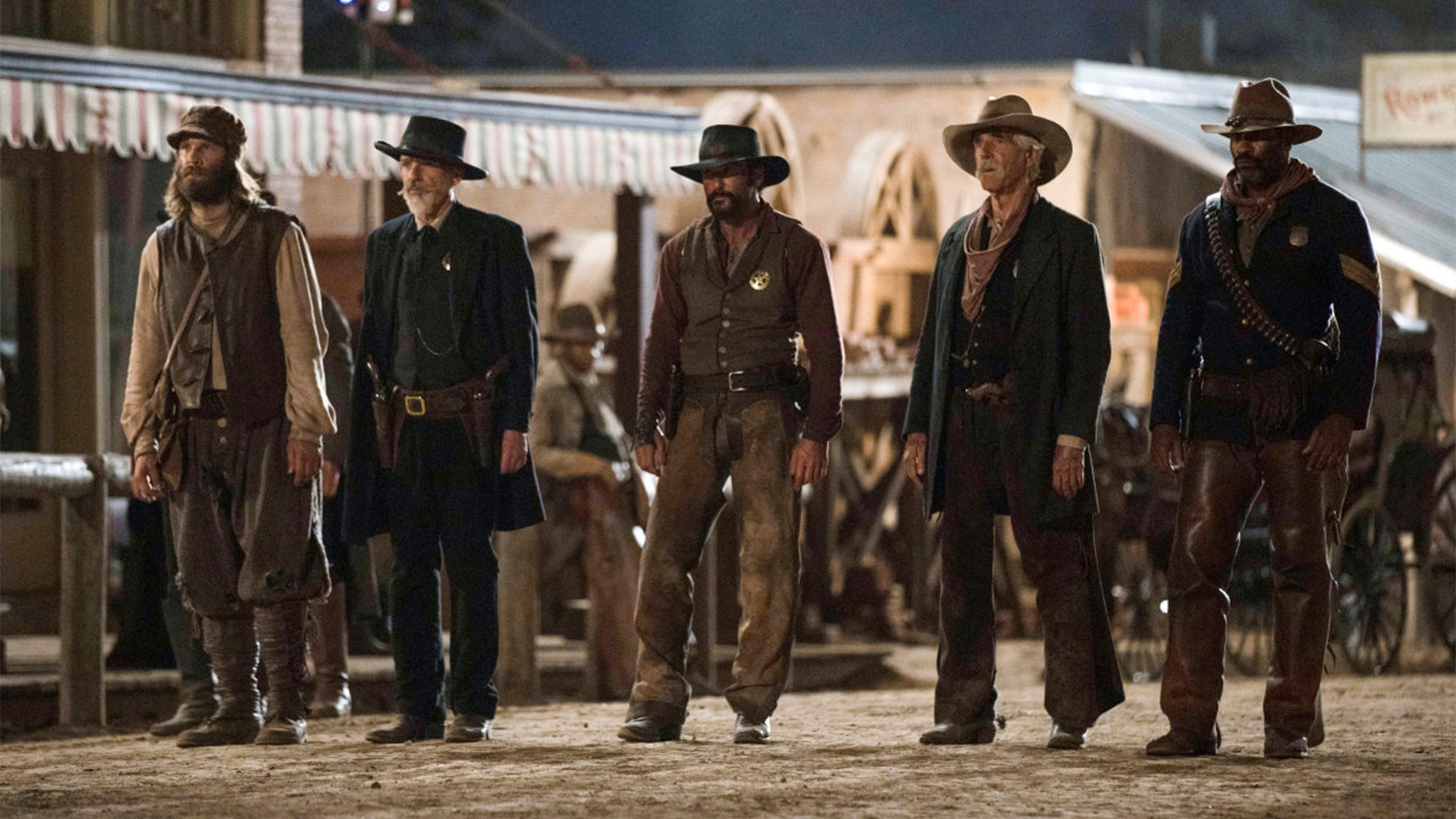 Five cowboy-type characters standing in a line