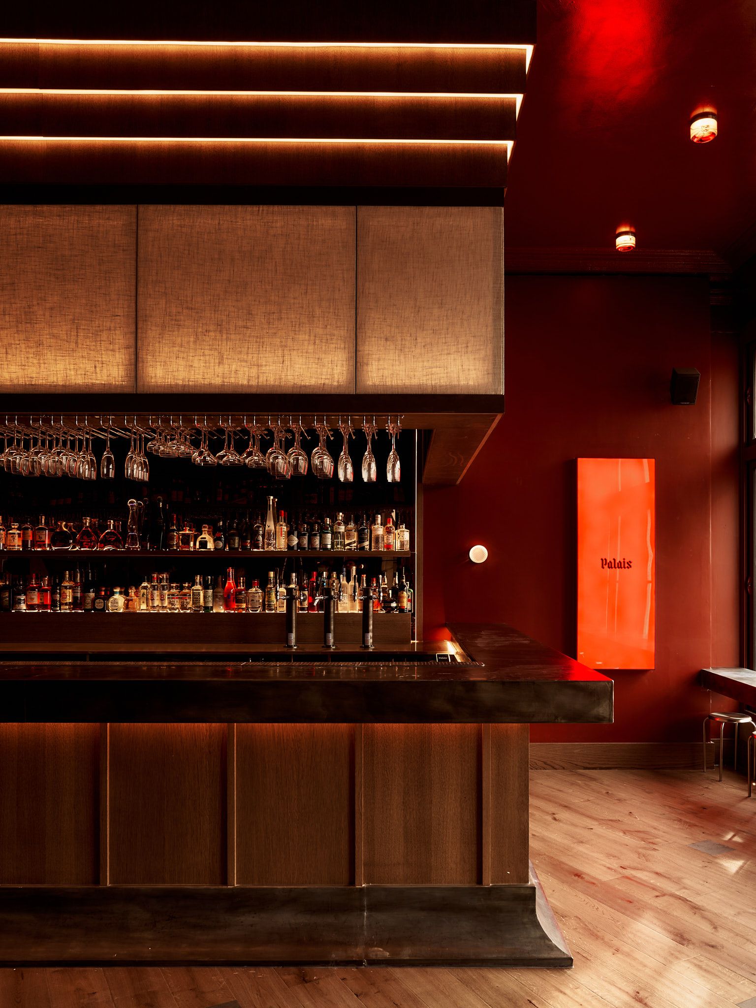 Why Are All the Coolest Bars Painted Red Right Now? Design Notes From These "Intimate and Transportive" Spaces You'll Want to Bring Home