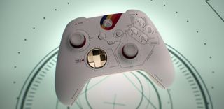 a white-and-gold video game controller