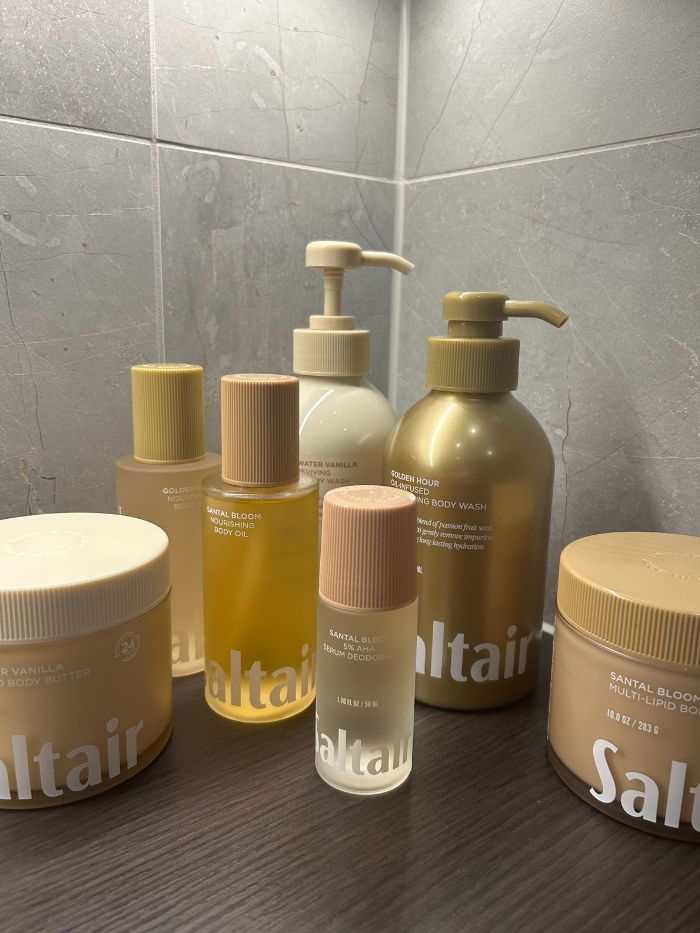 Lots of Saltair products on side of a marble bathroom