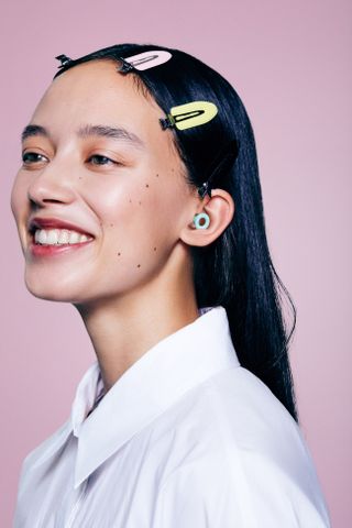 woman with colourful hair slides and earplugs