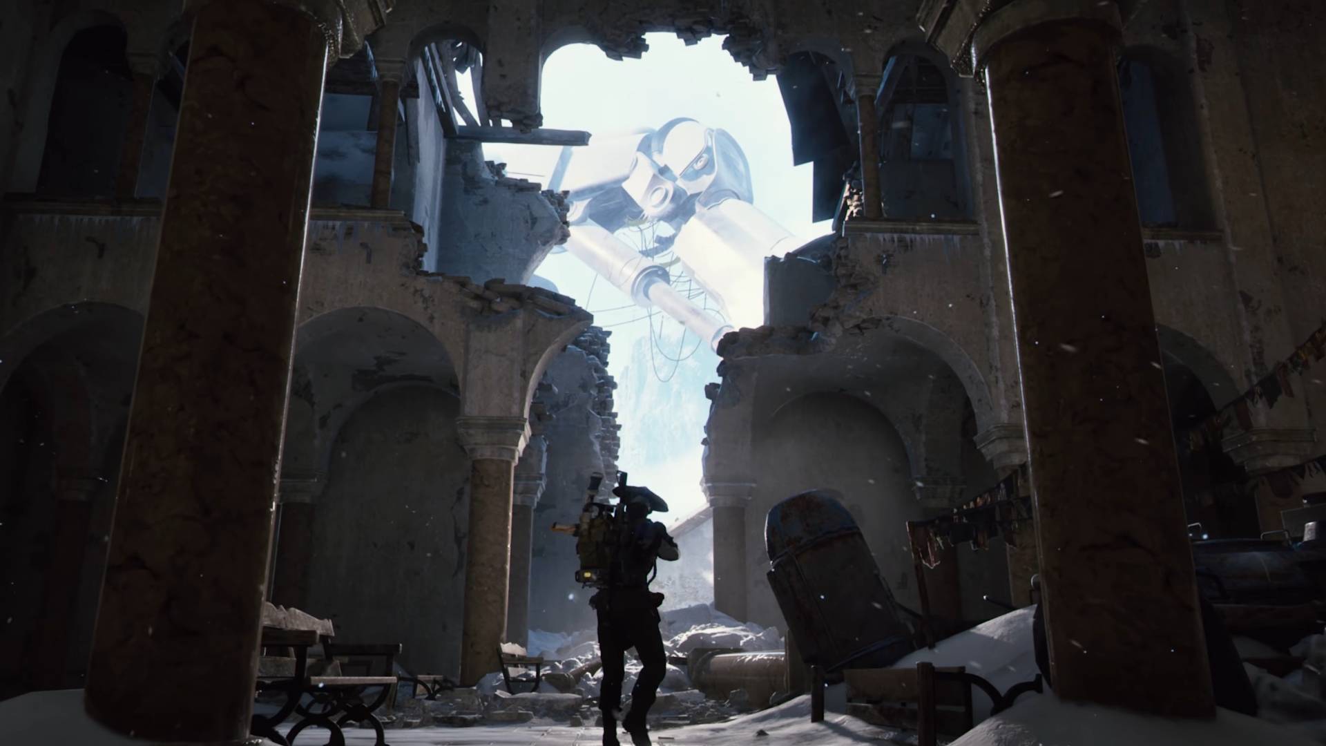 Arc Raiders Frozen Trail update trailer image raider in ruined building with leg of destroyed emperor robot visible outside
