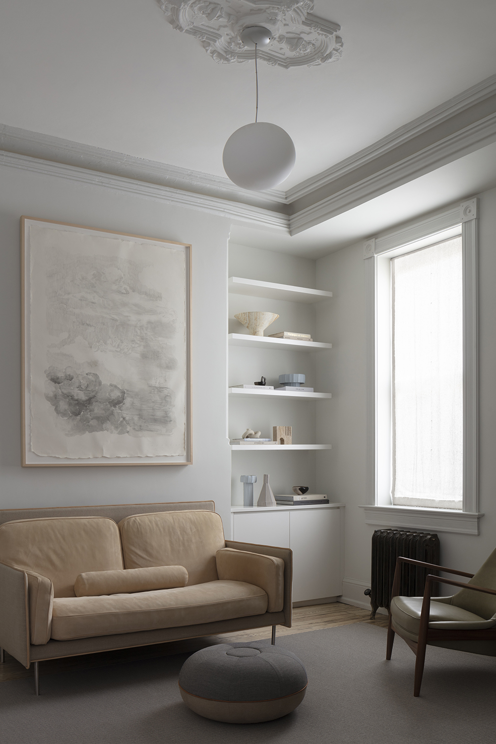 neutral living room with caramel sofa and baby blue accessories