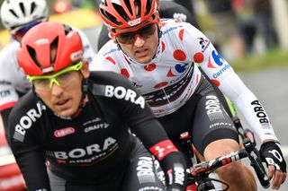 Cesare Benedetti (L) and Germany's Paul Voss (R), wearing the best climber's polka dot jersey, ride in a breakaway during the 183 km second stage of the 103rd edition of the Tour de France