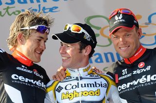 Columbia-Highroad’s Mark Cavendish tries to console second-placed Heinrich Haussler on the podium of the 2009 Milan-San Remo, with Haussler’s Cervélo TestTeam teammate Thor Hushovd having taken third
