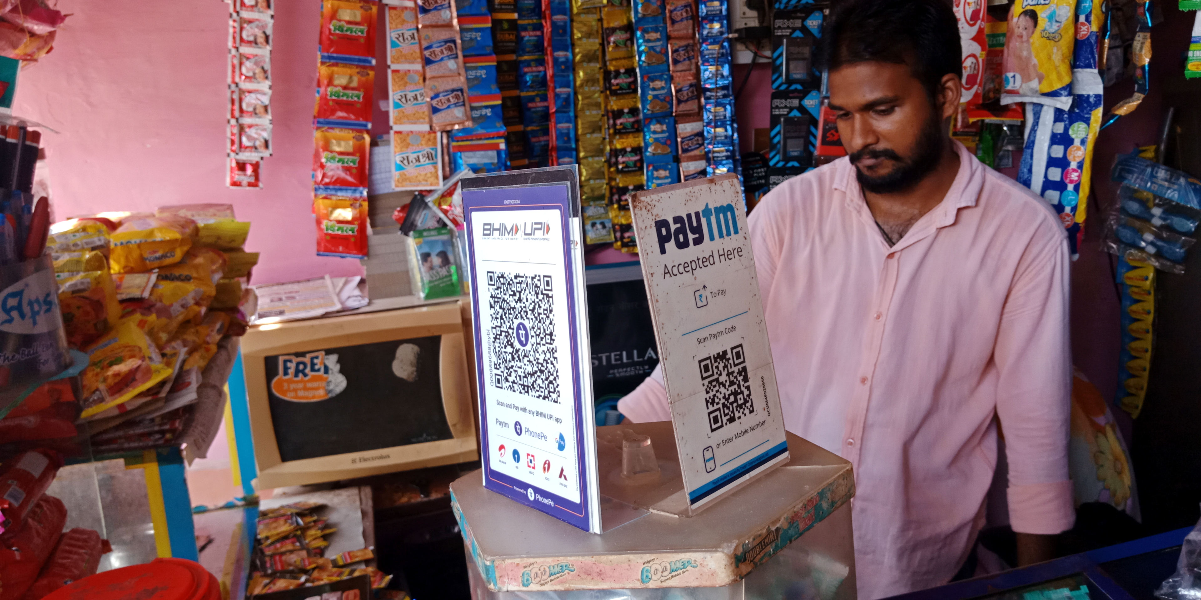 Paytm and BHIM UPI board displayed for online buying purpose at grocery shop