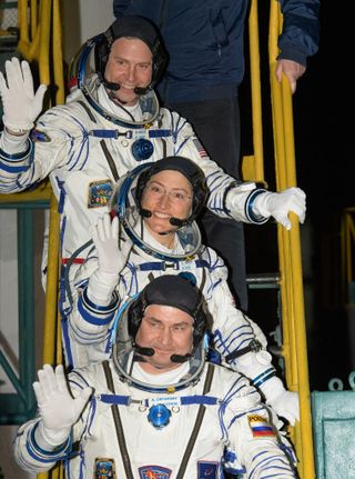 NASA astronauts Nick Hague and Christina Koch, joined by Russian cosmonaut Alexey Ovchinin, prepare for launch on March 14, 2019.