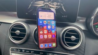 YOSH magnetic car phone mount holding an iPhone