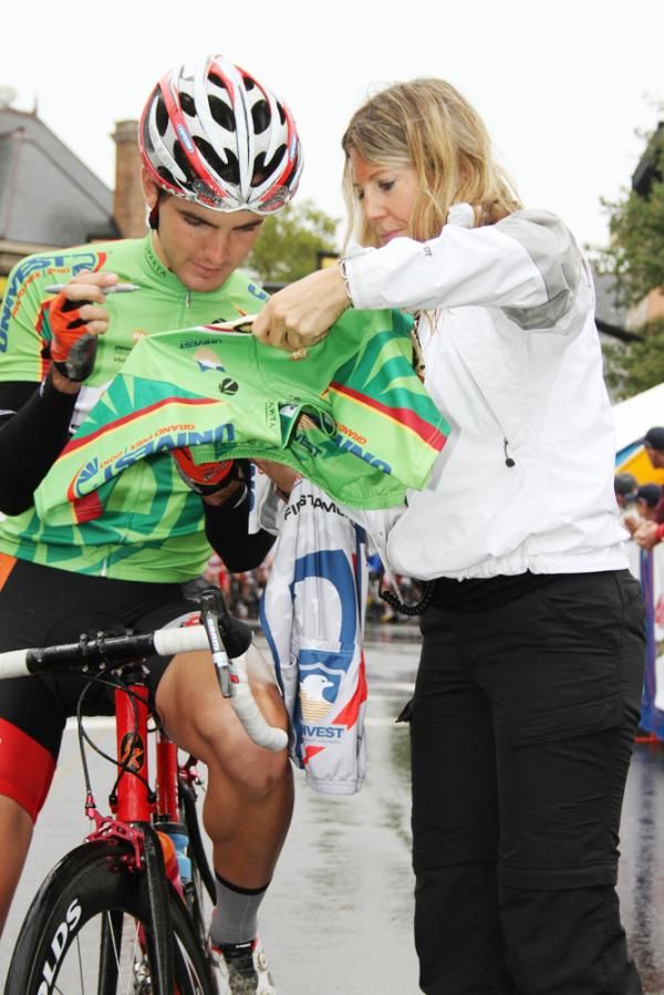 Sprint winner Joey Rosskopf (Mountain Khakis/Jittery Joe's) signs jerseys at the line.