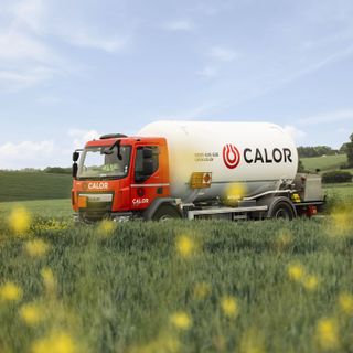 Calor gas tanker driving past a field