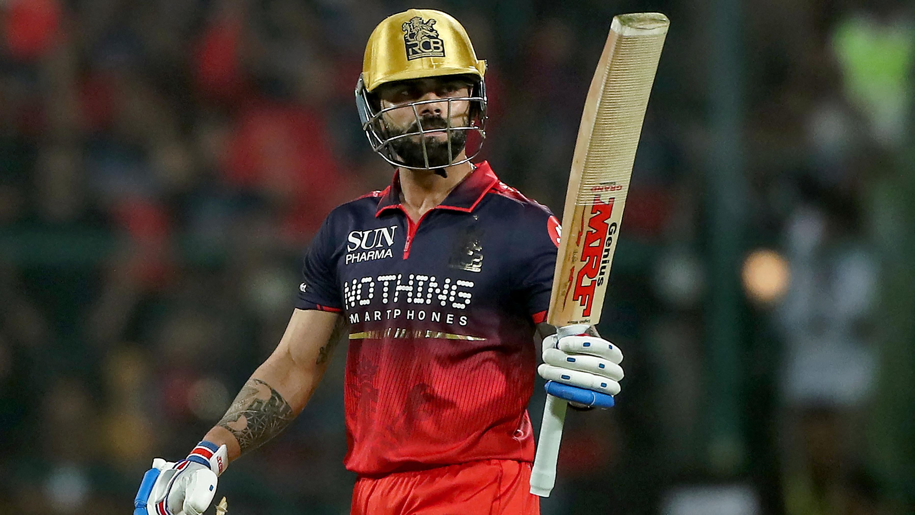 Royal Challengers Bengaluru's Indian cricket player Virat Kohli celebrates after scoring a half-century (50 runs) during the 2026 Indian Premier League (IPL) T20 match between Royal Challengers Bengaluru and Sunrisers Hyderabad