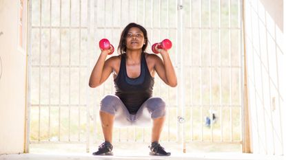 Woman doing a dumbbells workout