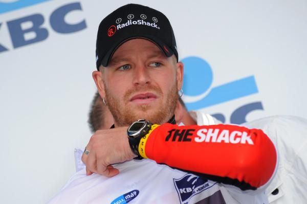 S&eacute;bastien Rosseler (RadioShack) zips up the leader's jersey.