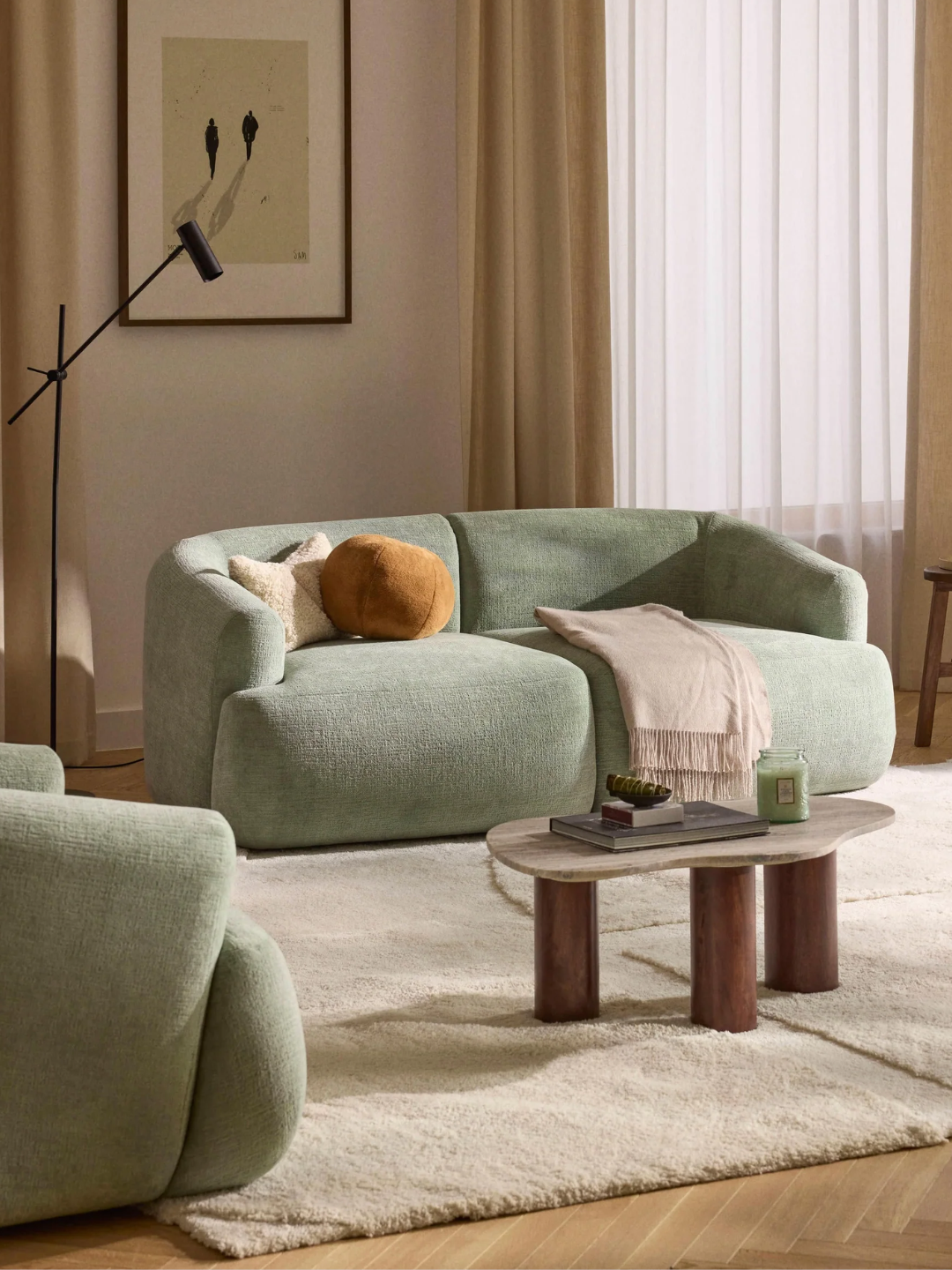A sage green modular two-seater sofa from Westwinf