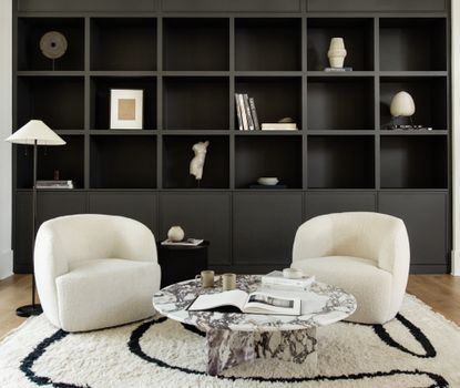A living room with a large bookshelf
