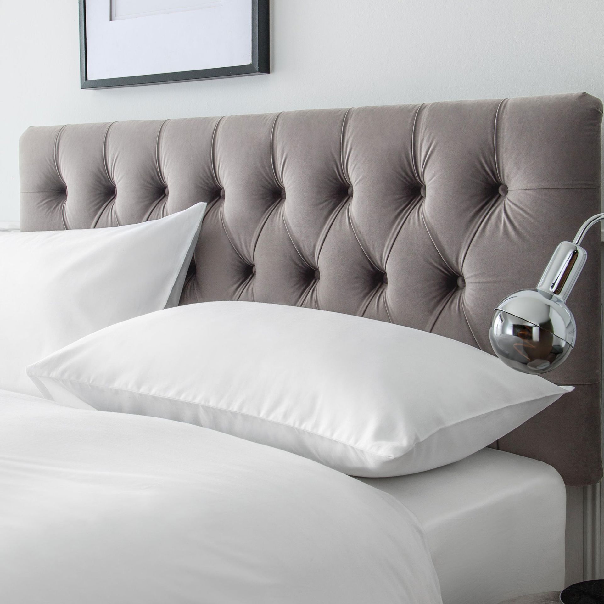 grey velvet headboard and pillows