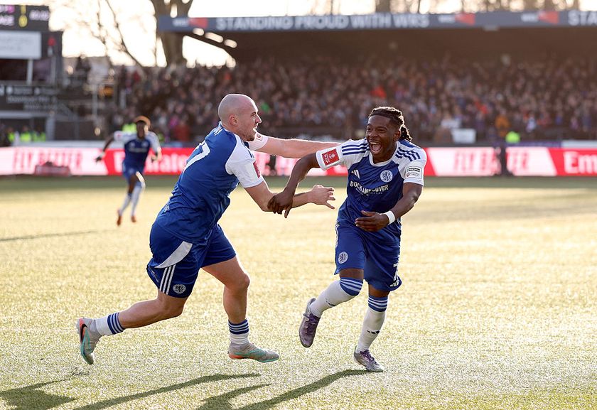 Isaac Buckley-Ricketts of Macclesfield celebrates scoring his team's second goal with teammate Josh Kay during the Emirates FA Cup Third Round match between Macclesfield and Crystal Palace at Moss Rose Ground on January 10, 2026 in Macclesfield, England.
