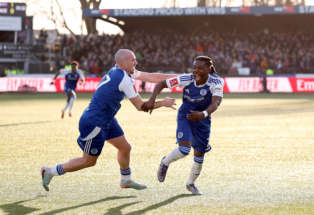 Isaac Buckley-Ricketts of Macclesfield celebrates scoring his team's second goal with teammate Josh Kay during the Emirates FA Cup Third Round match between Macclesfield and Crystal Palace at Moss Rose Ground on January 10, 2026 in Macclesfield, England.