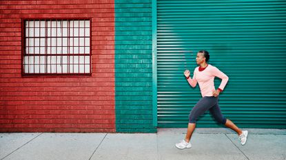Woman on an urban run, as part of a running plan for beginners