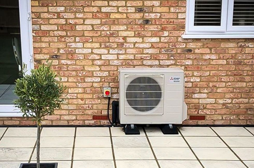 hybrid heat pump outside of brick house