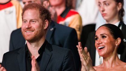 Prince Harry, Duke of Sussex and Meghan, Duchess of Sussex are seen during the closing ceremony of the Invictus Games.