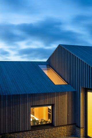 night view of Modern Barn by Coffey Architects