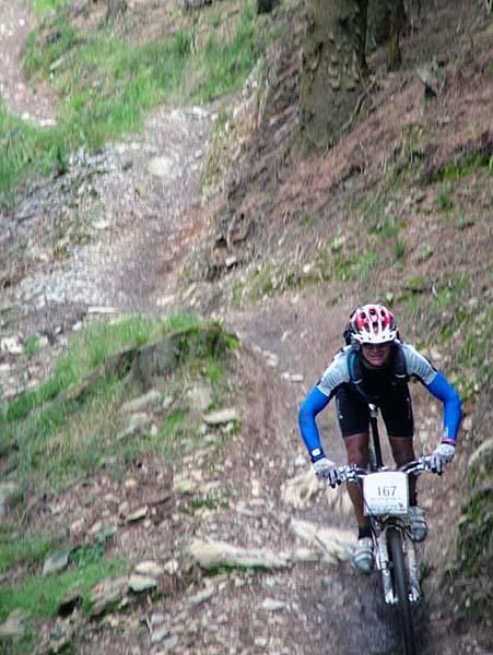 A rider buzzes past.
