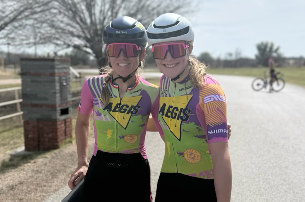 Lauren Stephens (left) and Kylee Hanel show off the new kit for 2026 Aegis x Land of Enchantment US road team